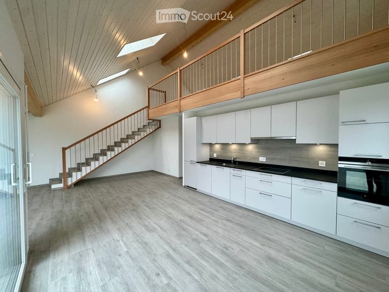 open kitchen, wooden stairs, wooden ceiling, white cabinets, black countertops, modern design