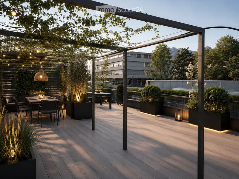 A modern outdoor patio with wooden decking, a dining table with chairs, ambient lighting, potted plants, and a view of a cityscape and mountains.