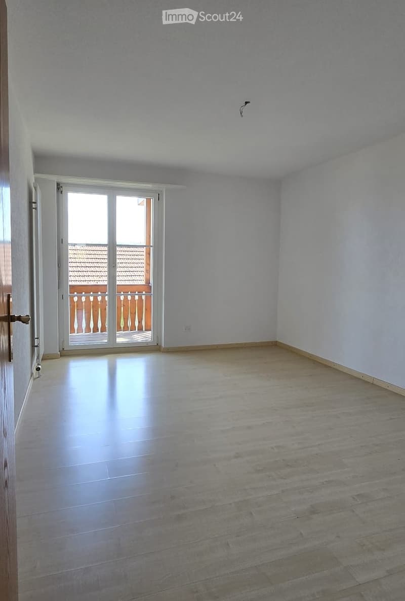 empty room, wooden floor, white walls, sliding glass door, balcony