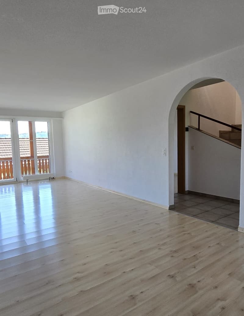empty room, wooden floor, white walls, large windows, balcony, staircase