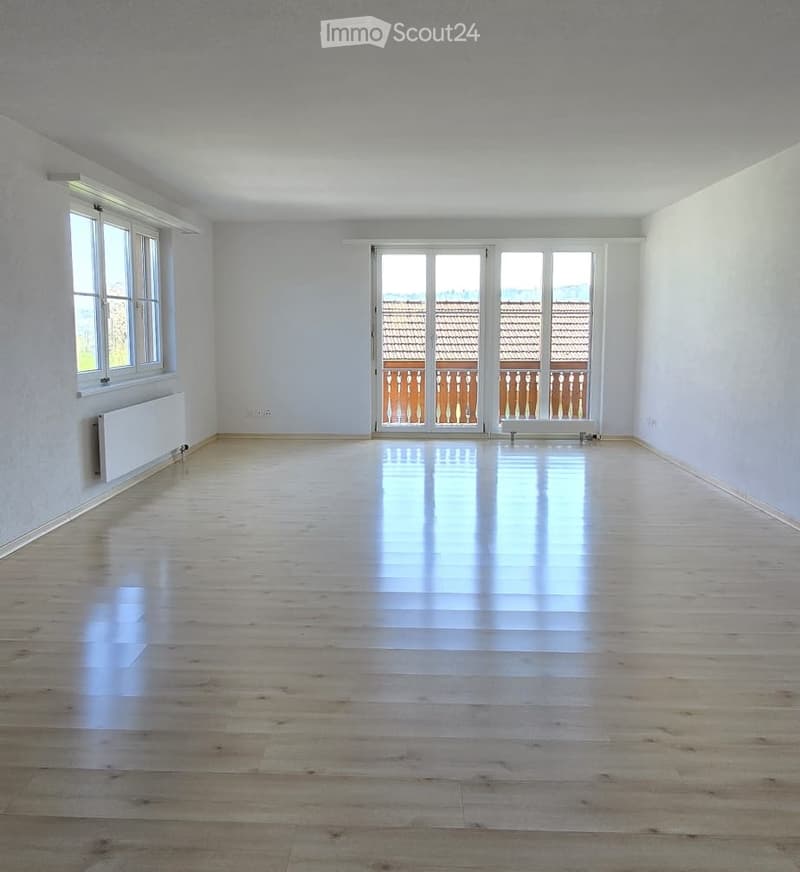 empty room, wooden floor, white walls, large windows, balcony