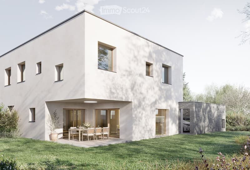 Modern two-story house with white exterior, large windows, and a raised ground floor. Features a patio area with a dining table and chairs, a small garden, and a garage with a parked car.