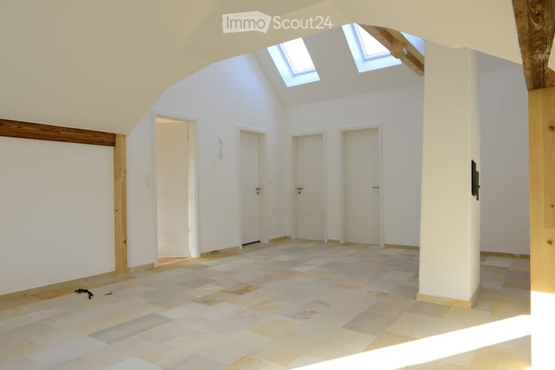 tiled floor, skylights, wooden supports, multiple doors