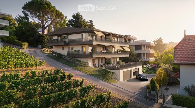 Modern two-story residential building with balconies, garage, and surrounding greenery.