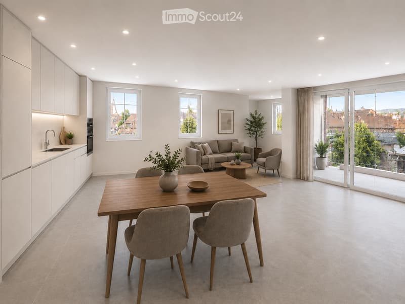 Open-plan living and dining area with modern furniture, large windows, and a view of the city.