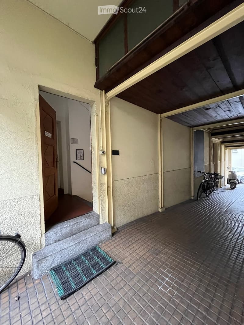 entrance hall, paved floor, bicycles, garage, parking area