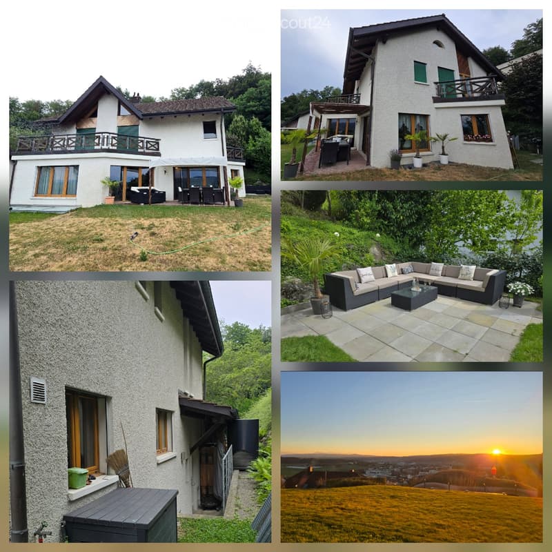 A modern two-story house with white exterior, large windows, balconies, and a well-maintained garden. Features include a patio seating area, outdoor furniture, and scenic views.
