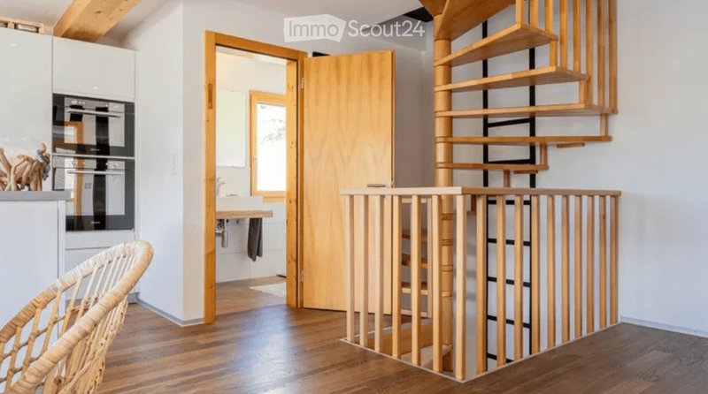 wooden floor, wooden spiral staircase, white walls, kitchen area, bathroom