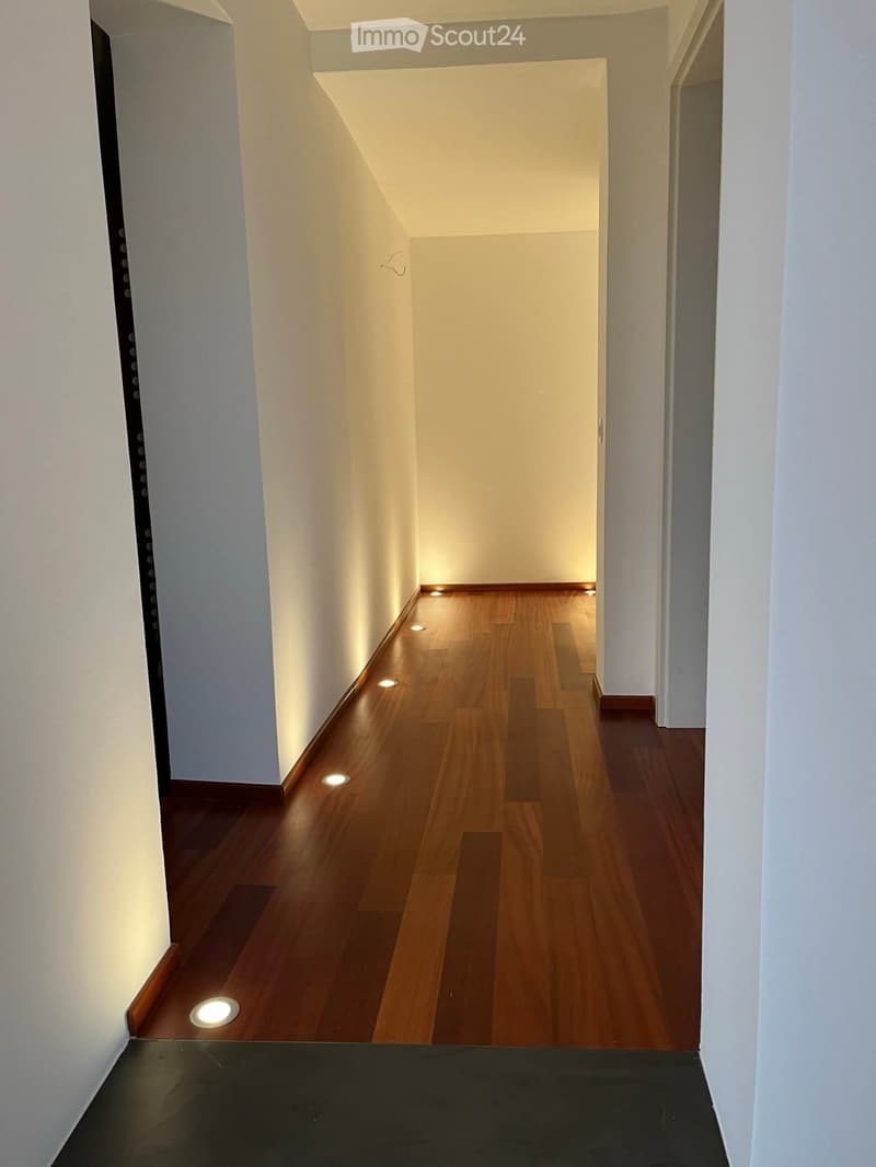 Wooden flooring, recessed lighting, white walls, clean and spacious