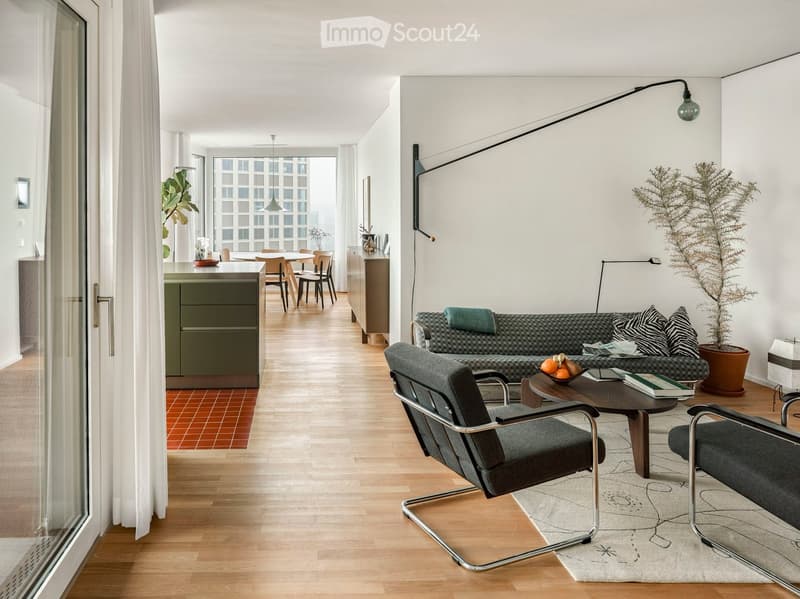modern living room with wooden floor, large windows, couch, coffee table, plants, modern lamps, dining area