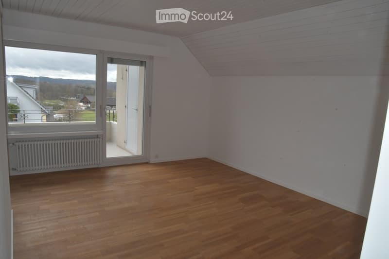empty room, wooden floor, white walls, sliding glass door, balcony, radiator, view of the outside