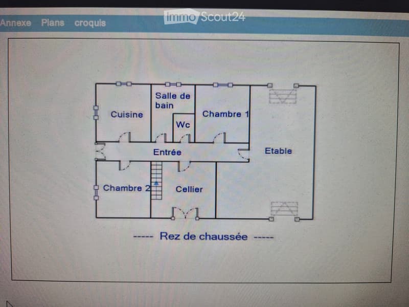 Floor plan of a ground floor showing a kitchen, bathroom, two bedrooms, living room, entrance, cellar, and WC.