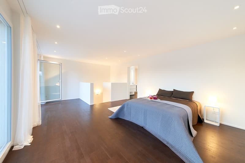 modern bedroom, white walls, hardwood floor, large window, double bed with pillows, bedside table with lamp