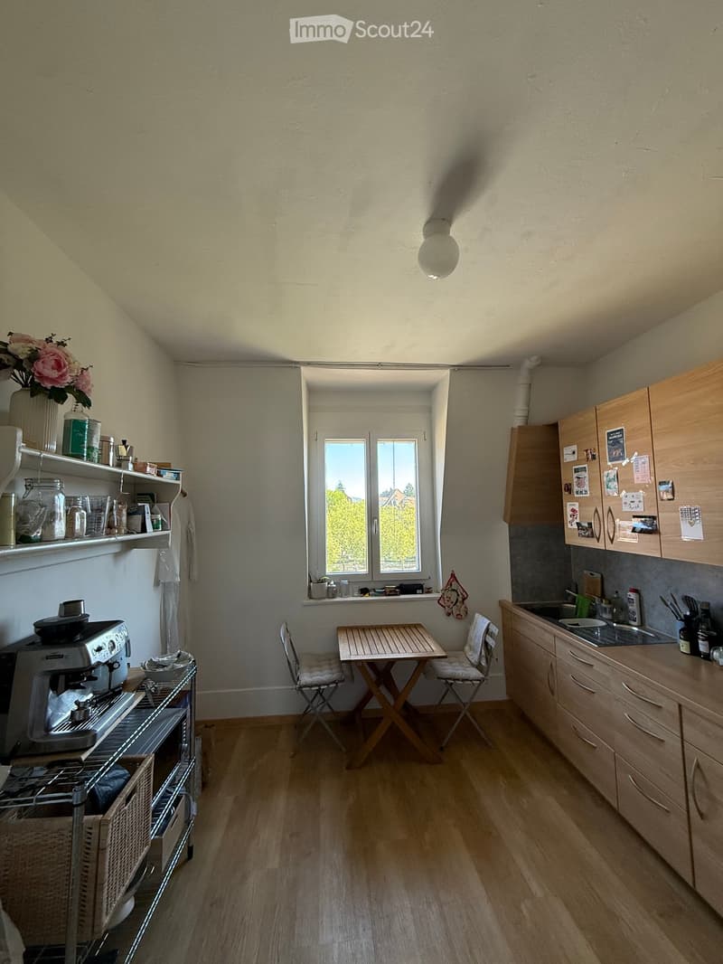 {"type": "Kitchen", "objects": ["refrigerator", "coffee maker", "sink", "cabinets", "table", "chair", "shelves", "vase", "flower", "cupboard", "oven", "faucet", "bottle", "cup", "oven", "cupboard", "cupboard", "cupboard", "cupboard", "cupboard", "cupboard
