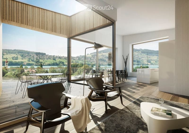 Modern living room with large windows offering a scenic view, featuring a sofa, coffee table, chairs, and a floor lamp.
