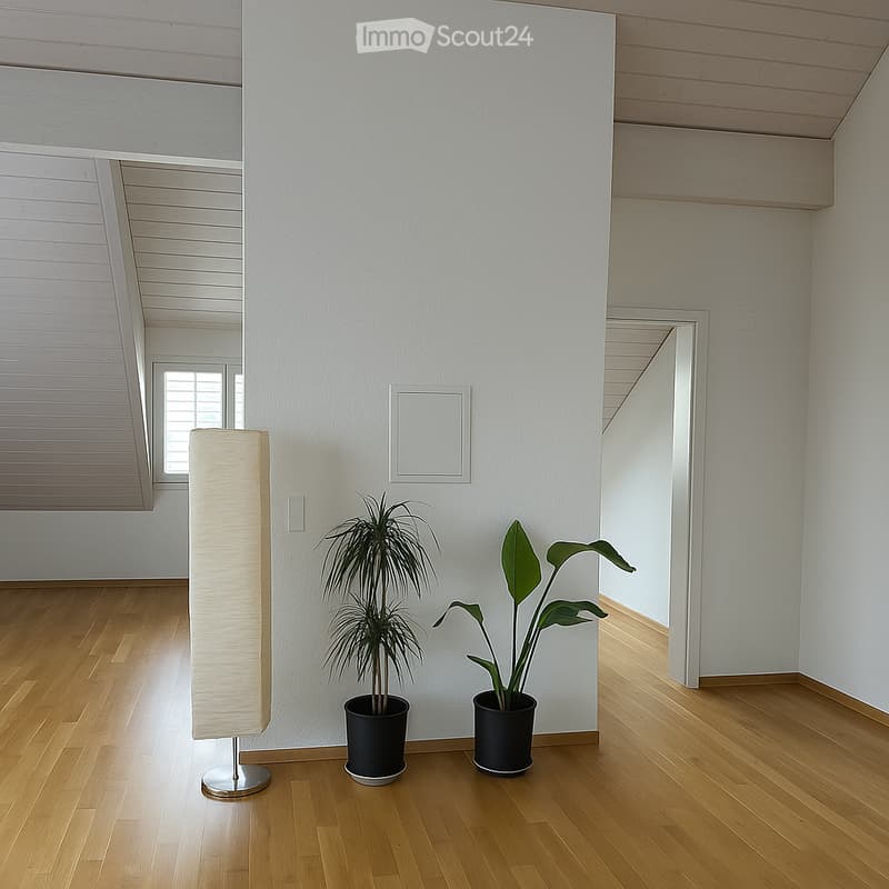 Bright, minimalist room with wooden flooring, white walls, and a large window. Features a floor lamp and two potted plants.