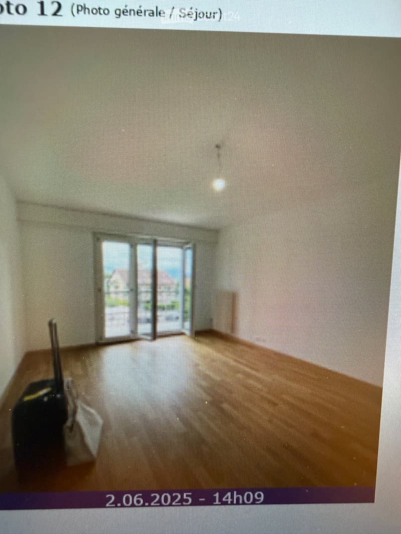Empty room with bare walls and wooden floor, no furniture or equipment visible.