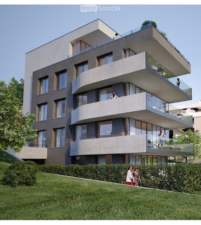 Modern multi-story residential building with balconies and large windows, surrounded by greenery.