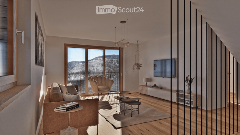 Modern living room with large windows offering a scenic mountain view, featuring a grey sofa, coffee table, armchair, ottoman, floor lamp, television, and decorative items.