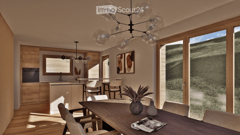 Modern open-plan dining and kitchen area with wooden flooring, large windows offering a scenic view, a central dining table surrounded by chairs, a kitchen island with pendant lights, and contemporary decor including artwork and a vase.