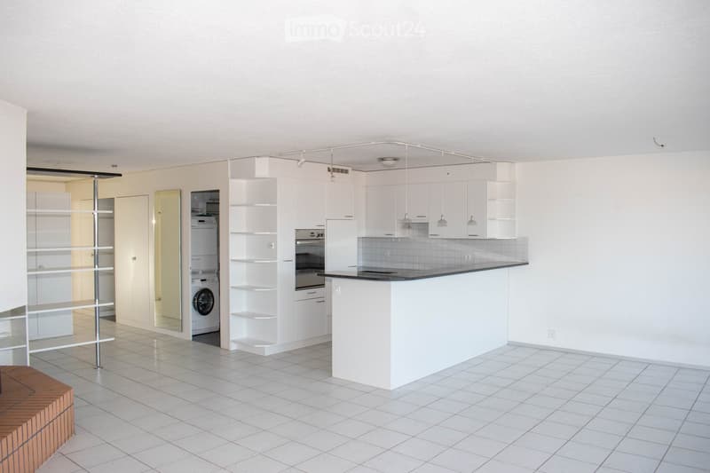 Open kitchen with white cabinets, tiled floor, white walls, dishwasher, washing machine, island with granite countertop, ceiling lights