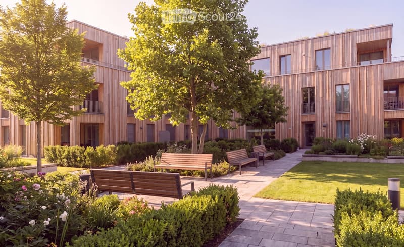 Modern wooden building surrounded by a landscaped garden with benches, trees, and shrubs.
