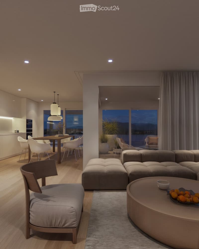 Modern living and dining area with a sofa, coffee table, dining table, chairs, pendant lights, and a view of the city at night.
