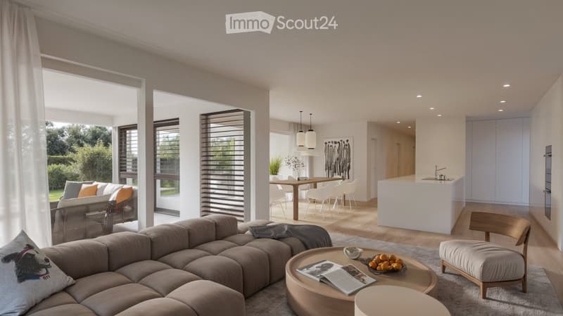 Open-plan living and dining area with modern furniture, large windows, and a kitchen island.