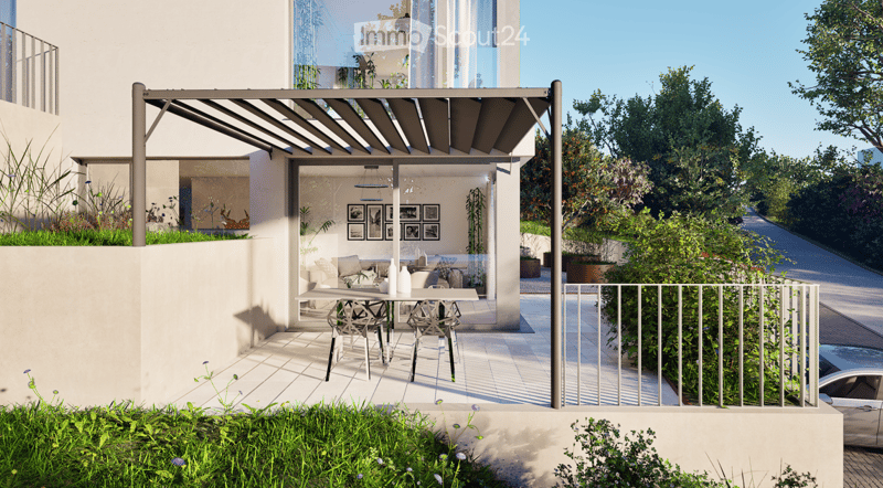 Modern outdoor terrace with a pergola, dining table, chairs, and a view of a landscaped garden.