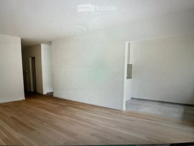 Completely empty room with bare walls and wooden floor. No furniture or equipment.