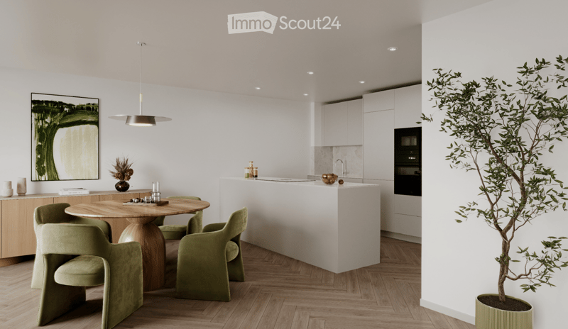 Modern kitchen and dining area with white cabinets, a wooden dining table surrounded by green chairs, a pendant light, and a potted plant near the island.