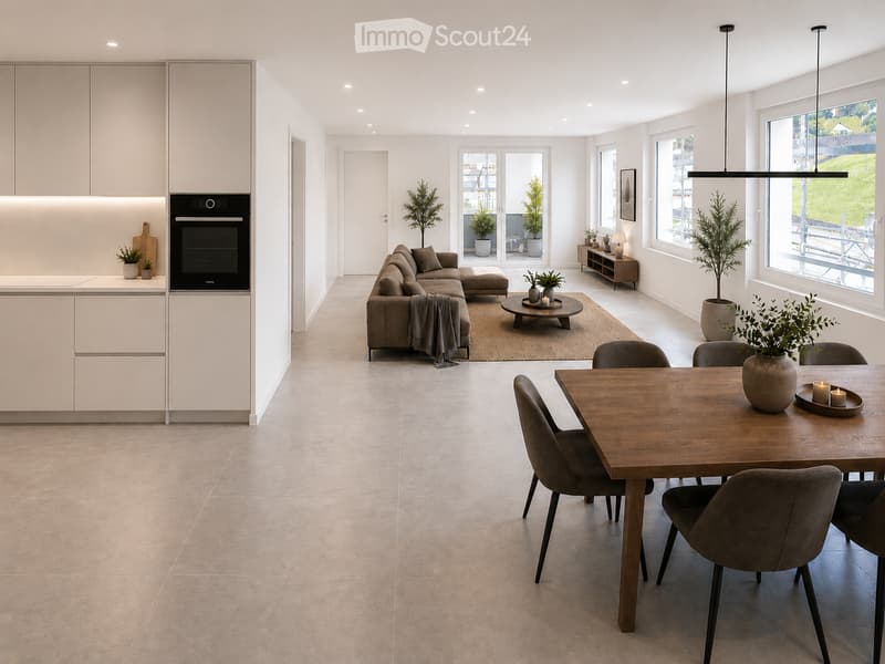 Open-plan living and dining area with modern furniture, including a grey sectional sofa, wooden coffee table, dining table with chairs, and integrated kitchen with cabinets and an oven. Large windows provide natural light, and potted plants add greenery.