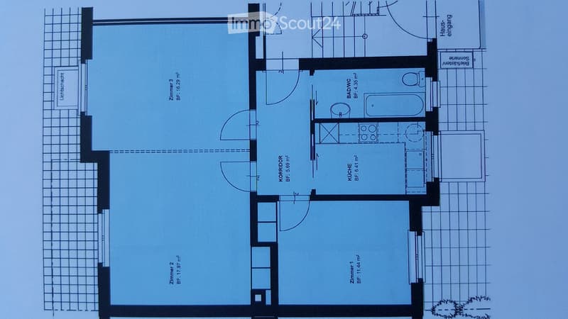 Floor plan showing a kitchen, bathroom, three bedrooms, and entrance area.