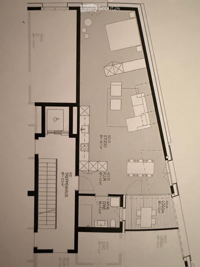 Floor plan showing a multi-room layout including a studio, living area, kitchen, and several bedrooms.