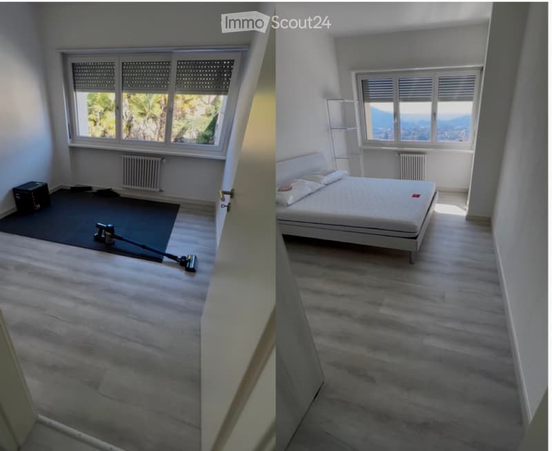 Bright bedroom with wooden flooring, large windows offering scenic views, a white bed with pillows, and a radiator below the window.