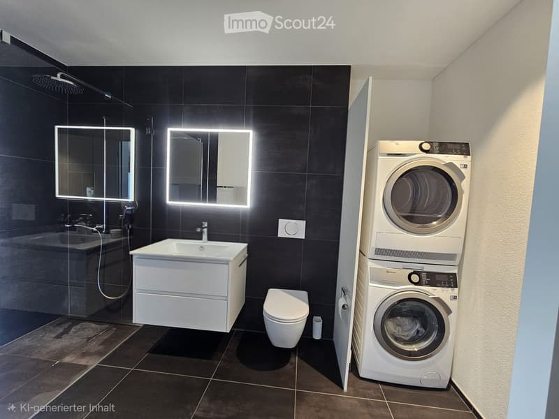 Modern bathroom with dark tiled walls, white sink, toilet, mirrored cabinets with LED lighting, and a stacked washer/dryer unit.