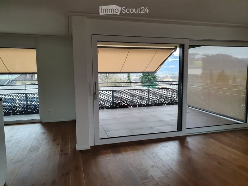 wooden floor, sliding glass doors, balcony, view of mountains