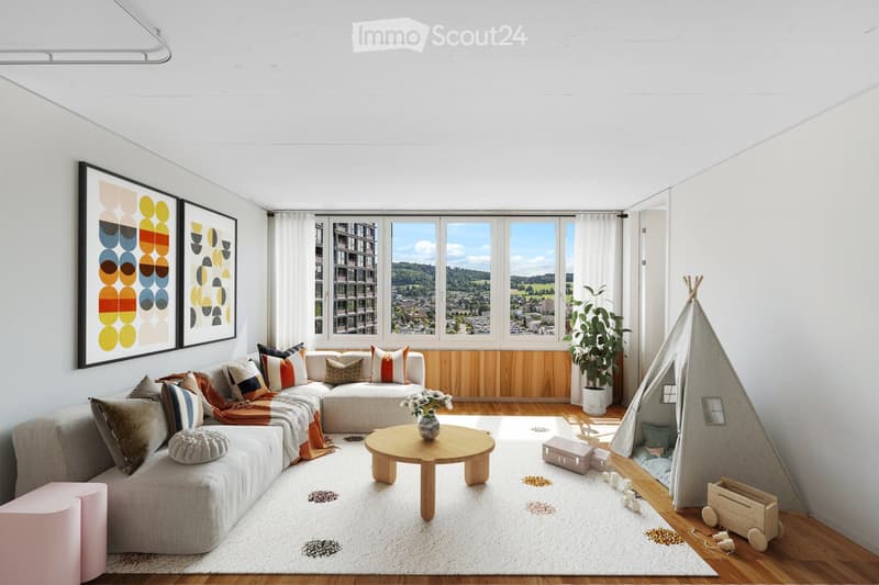 Modern living room with a grey sectional sofa, colorful throw pillows, a wooden coffee table with a vase, a large potted plant, a teepee play structure, and a toy wagon. Large windows offer a scenic view.