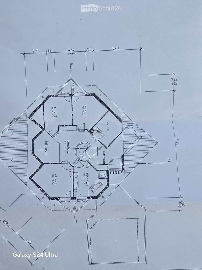 Floor plan of a multi-room layout including a living room, kitchen, bedrooms, and bathrooms, with labeled dimensions and room names.