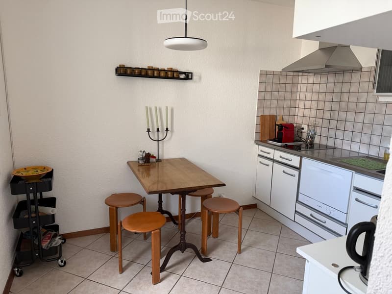 {"type": "Kitchen", "objects": ["table", "stool", "stool", "stool", "stool", "candle holder", "bowl", "cart", "dishwasher", "stove", "faucet", "cupboard", "cupboard", "cupboard", "cupboard", "cupboard", "cupboard", "cupboard", "cupboard", "cupboard", "cup