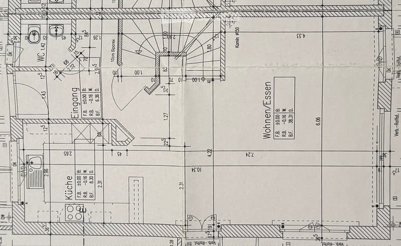 Floor plan of a residential space showing a kitchen, entrance area, and living area with labeled dimensions and room labels.