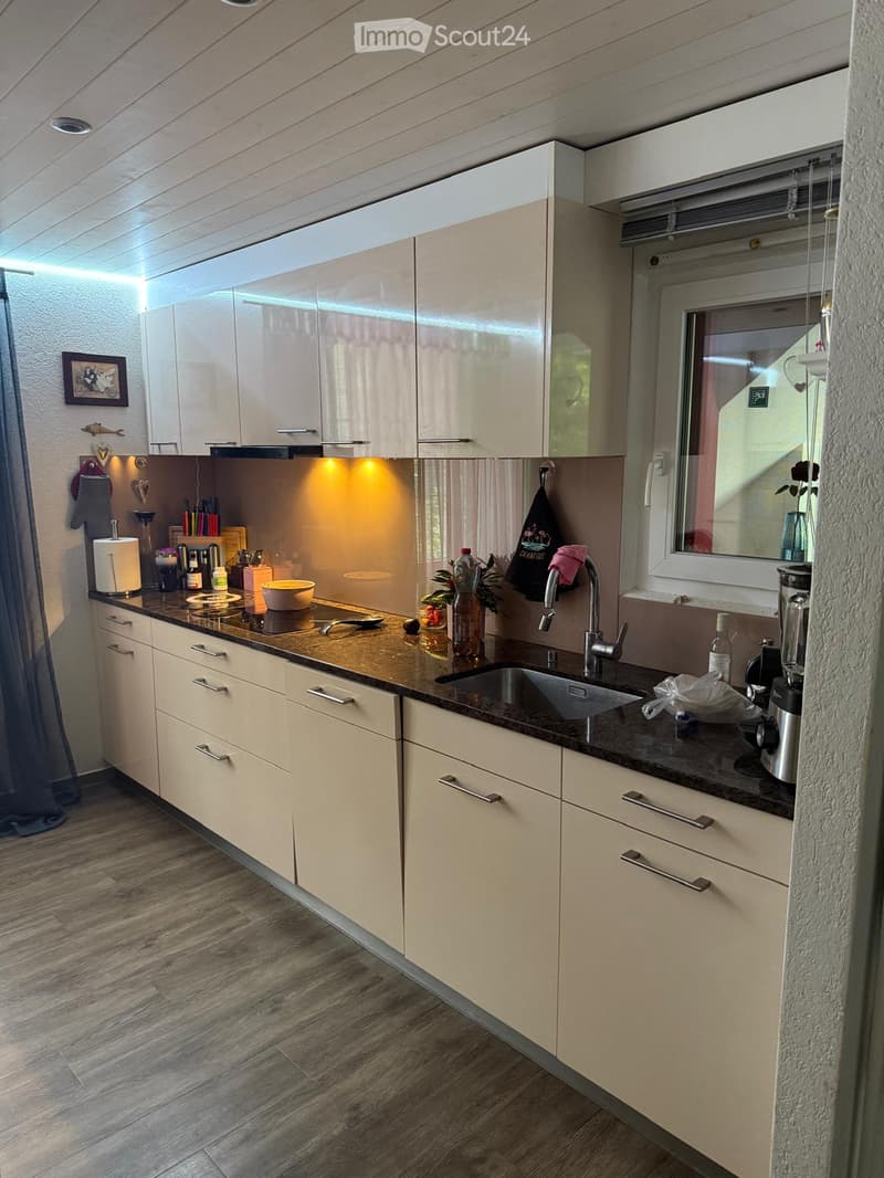 {"type": "Kitchen", "objects": ["sink", "faucet", "blender", "bowl", "fridge", "cupboard", "bottle", "framed picture", "towel", "faucet", "fridge", "cupboard", "cupboard", "cupboard", "cupboard", "cupboard", "cupboard", "cupboard", "cupboard", "cupboard",