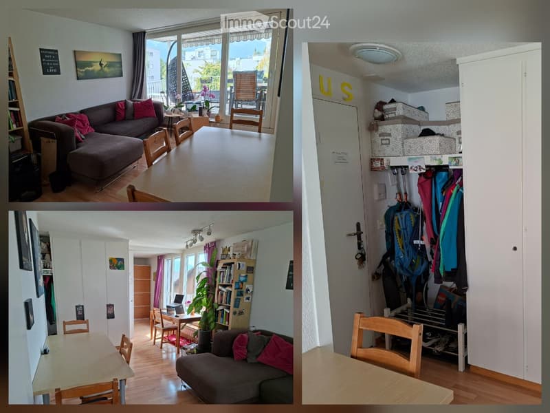The image shows a modern, well-furnished living space with a sofa, chairs, a dining table, a laptop on a desk, a bookshelf, and a plant. The room features large windows with a view, wooden flooring, and a coat rack with jackets and bags.