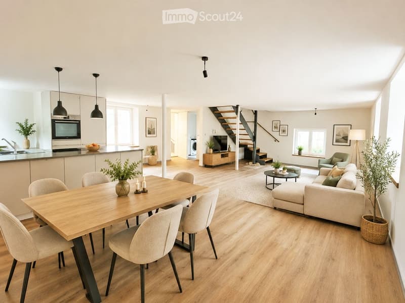 Open-plan living and dining area with modern furniture, including a sofa, coffee table, dining table with chairs, and a kitchen island with an oven and sink. The space features wooden flooring, pendant lights, and decorative plants.