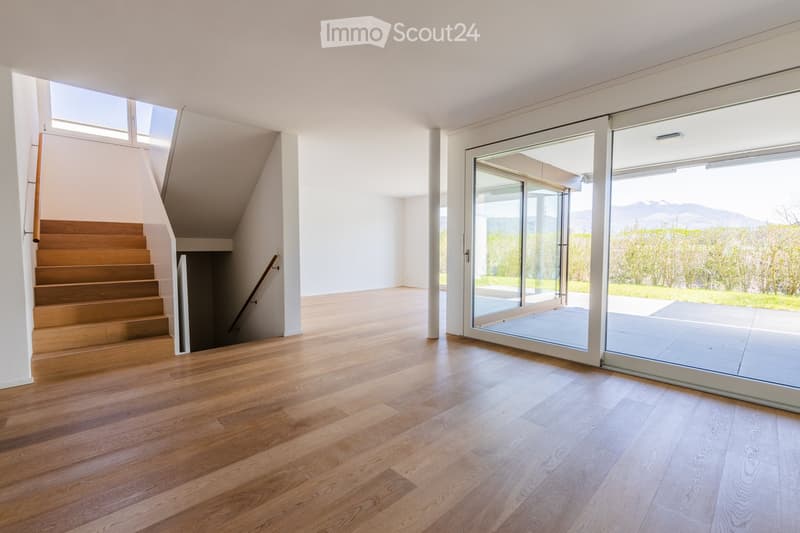 wooden floor, white walls, large windows, balcony, staircase