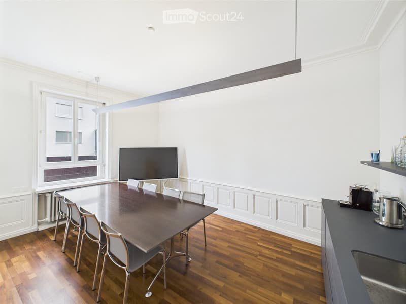 modern interior, wooden floor, rectangular dining table, chairs, TV, radiator, countertop, sink