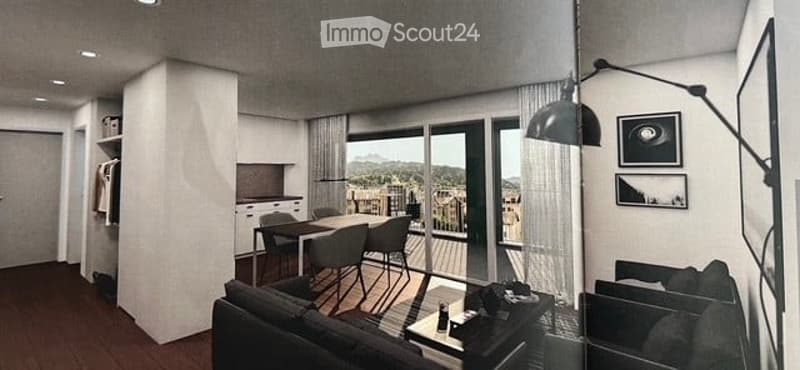 Modern open-plan living and dining area with large windows offering a scenic view, featuring a sofa, dining table with chairs, and a floor lamp.