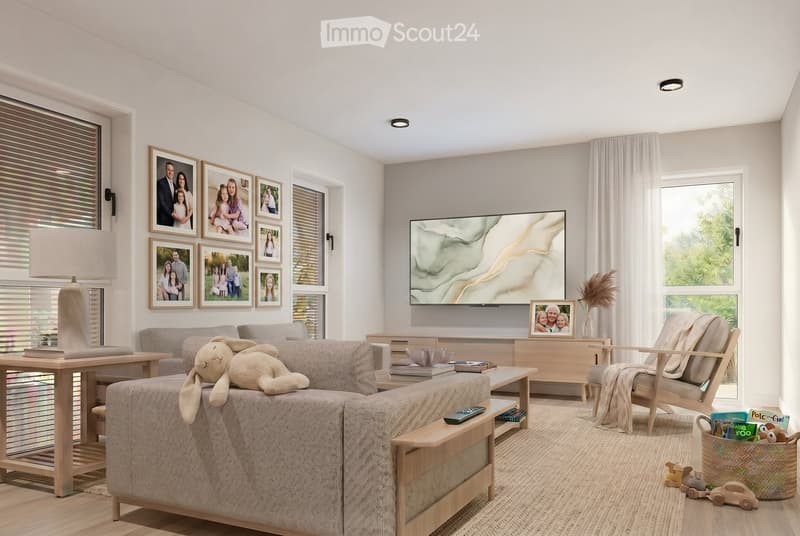 A modern living room with a grey sectional sofa, a wooden coffee table, a chair, a table lamp, a television, picture frames, a basket with toys, and books on the coffee table.