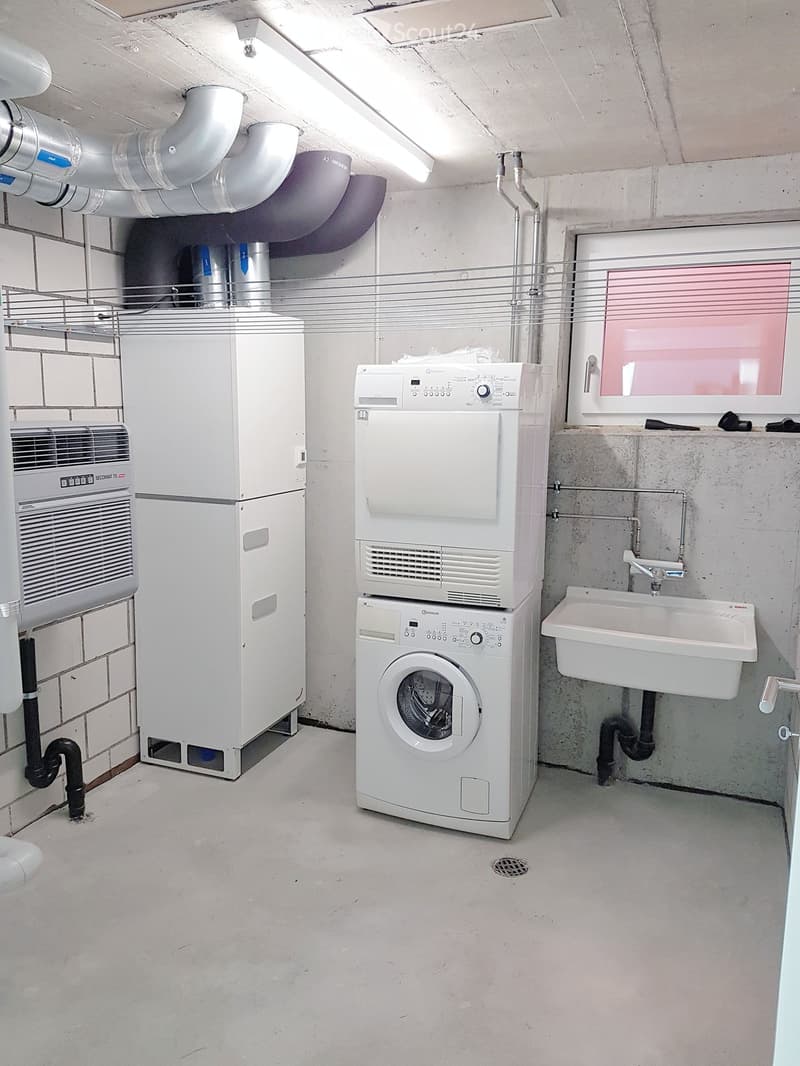 Laundry room with washing machine, dryer, and sink