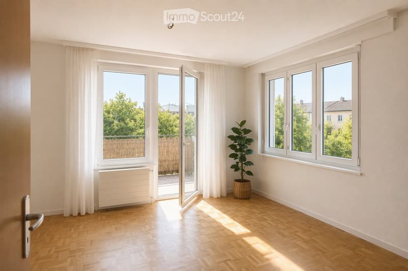 Empty room with wooden flooring, large windows, white walls, and a radiator. A potted plant is placed near the windows, and the room has a sliding glass door leading to an outdoor area.